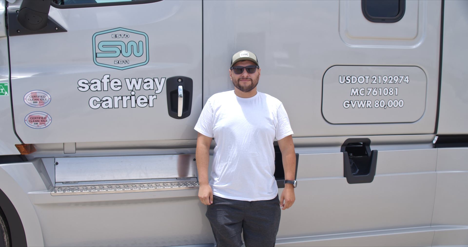 A Safe Way Carrier driver beside their truck